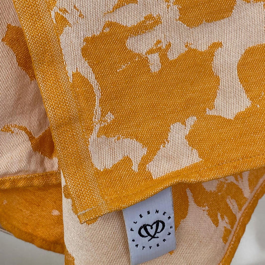 Plesner Patterns kjøkkenhåndkle i gult.